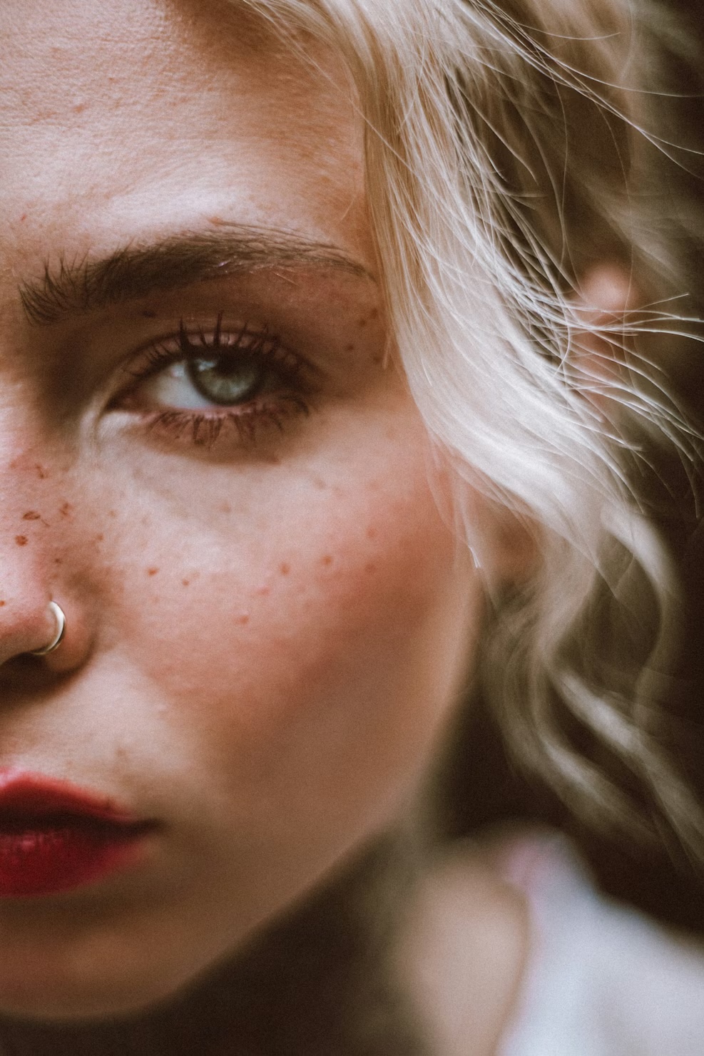 Smiling woman wearing a nose piercing jewelry